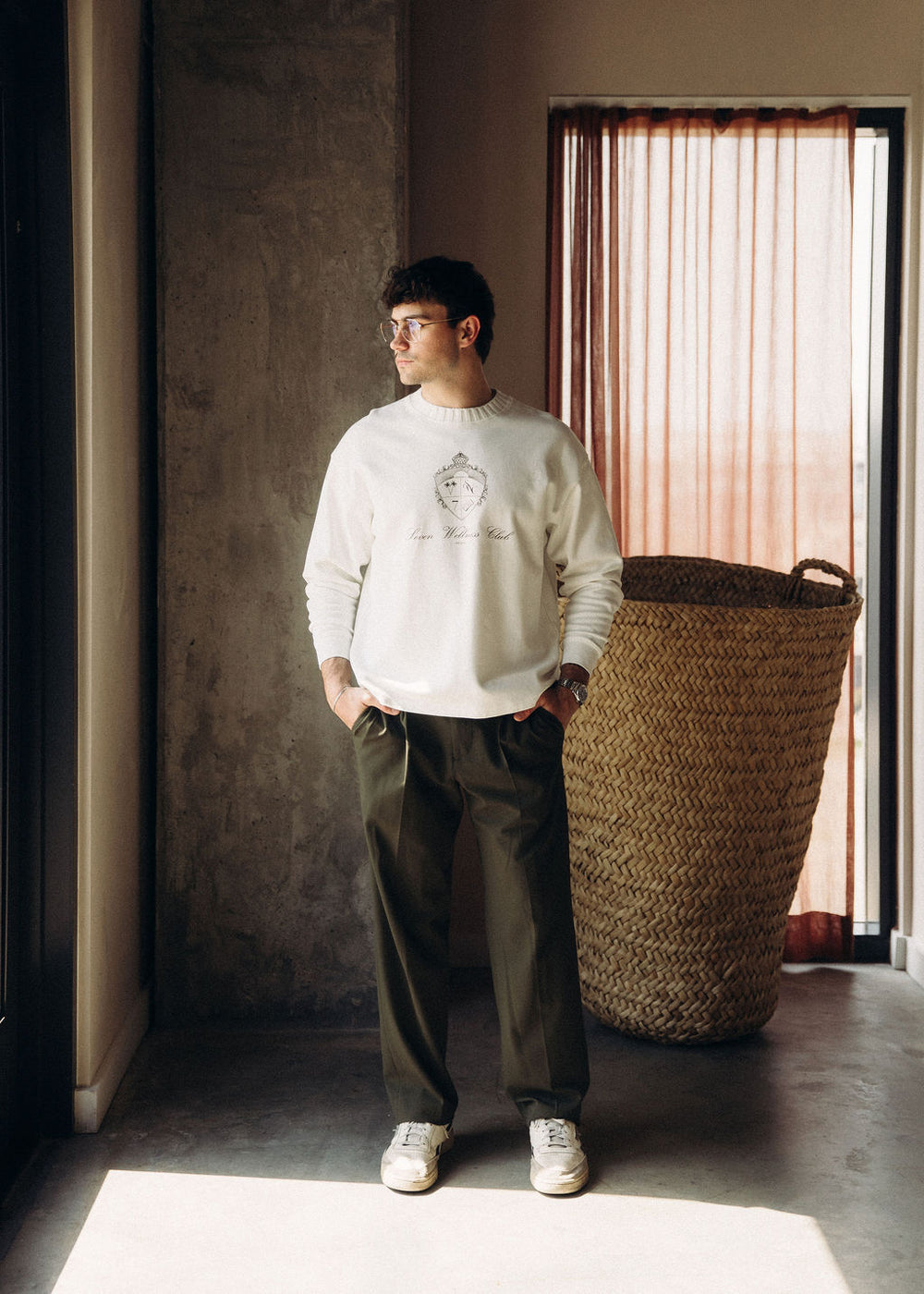 Model in the oversized cream Foundation Crewneck with drop shoulders